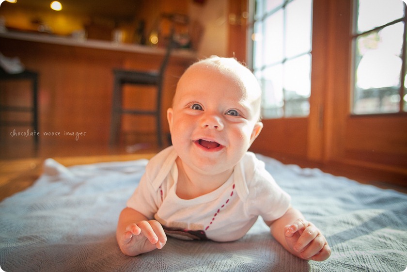 Little Charlotte models the assistant onesie showing her excitement to assist Chocolate Moose Images