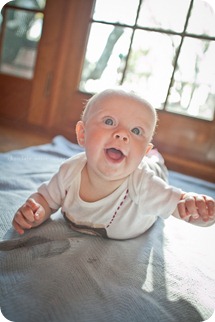 Little Charlotte models the assistant onesie showing her excitement to assist Chocolate Moose Images