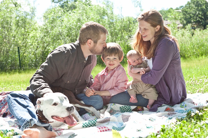 A beautiful family of 5 with 2 kiddos and a pit bull had portraits taken on a spring morning in Minnesota by Chocolate Moose Images
