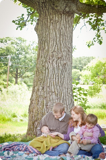 A beautiful family of 5 with 2 kiddos and a pit bull had portraits taken on a spring morning in Minnesota by Chocolate Moose Images