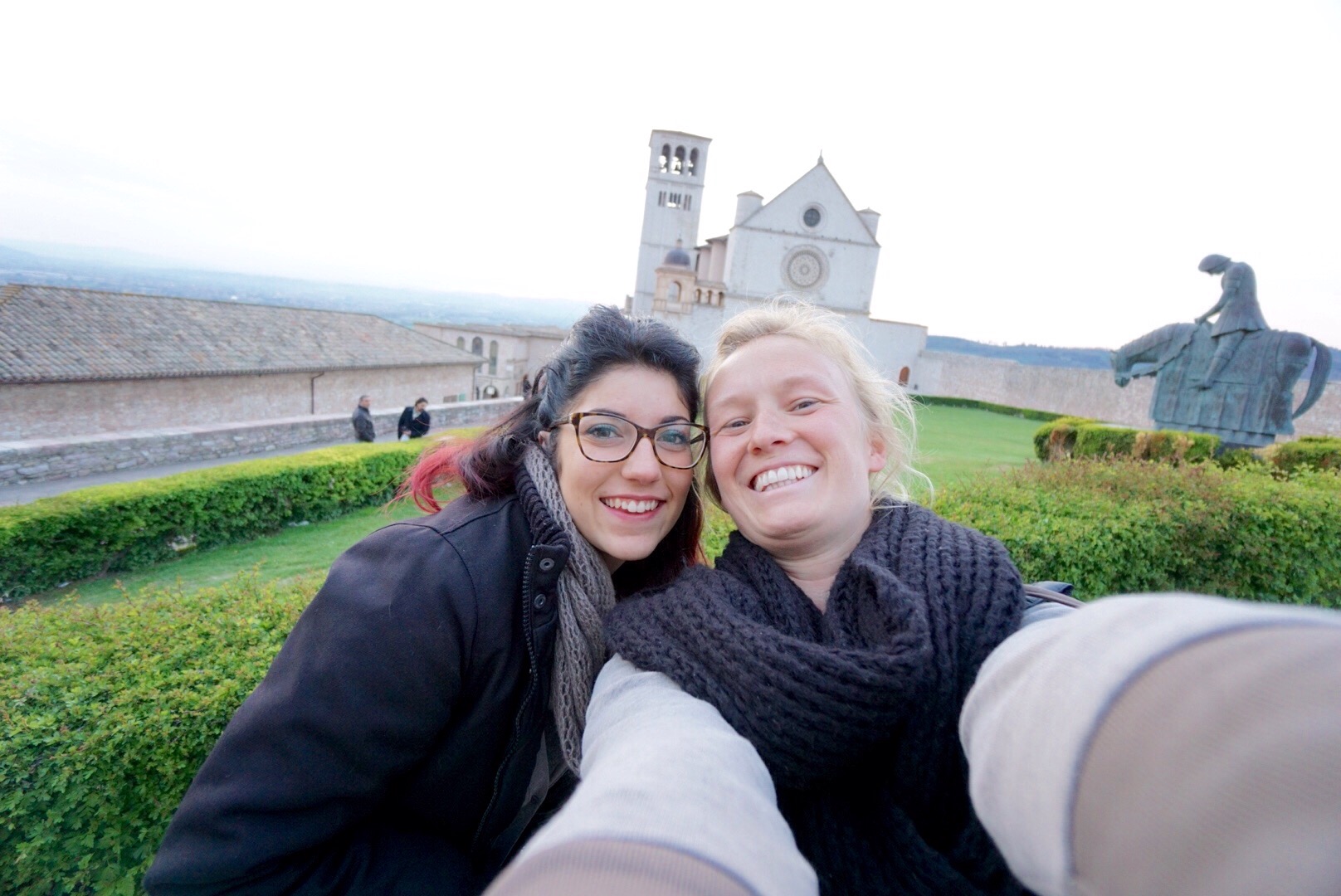 a self portrait of Angelica and Jess in Assisi in front of the basillica de san fernando